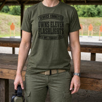Load image into Gallery viewer, Service Connected Owns Eleven Flashlights - Funny Veteran Tee in Military Green, woman, no face