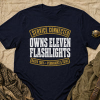 Load image into Gallery viewer, Service Connected Owns Eleven Flashlights - Funny Veteran Tee in Navy, props flat